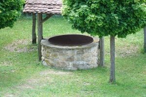 A beautiful shot of a restored deep well in a park