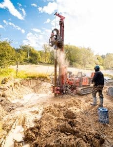 Drilling wells in the ground using a professional drill and machine